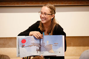 Museum educator presenting a children's bok