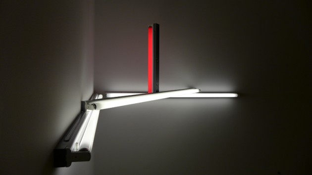 Dan Flavin's "monument" on the survival of Mrs. Reppin sculpture made of warm red and white fluorescent light