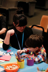 Museum Educator Assisting a Child